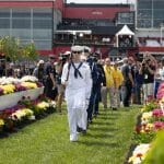 service members walking down to the winners circle at the Preakness Stakes