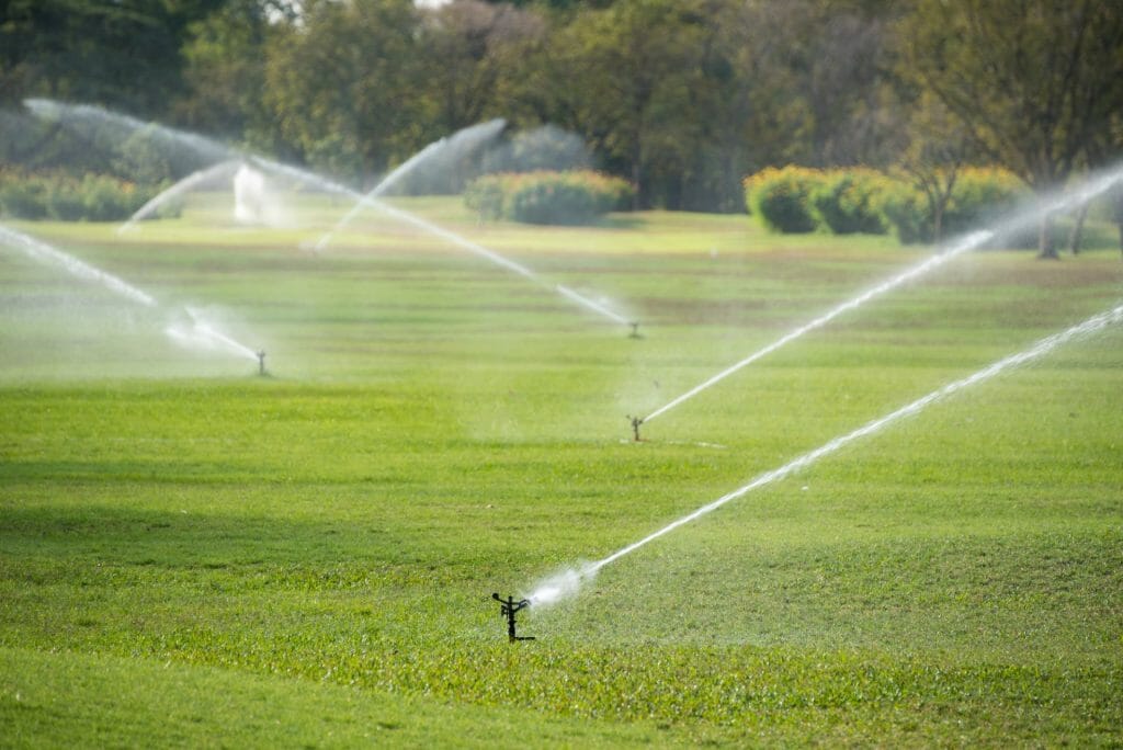 sprinkler system watering a field