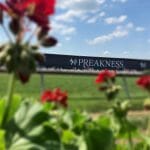 Preakness sign with flowers in the forefront